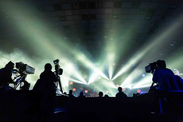 Silhouette of a group of cameramen broadcasting an event.